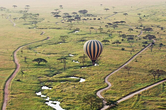 8-Day Kenya Group Joining Safari - Nairobi National Park closes the trip with city towers nearby