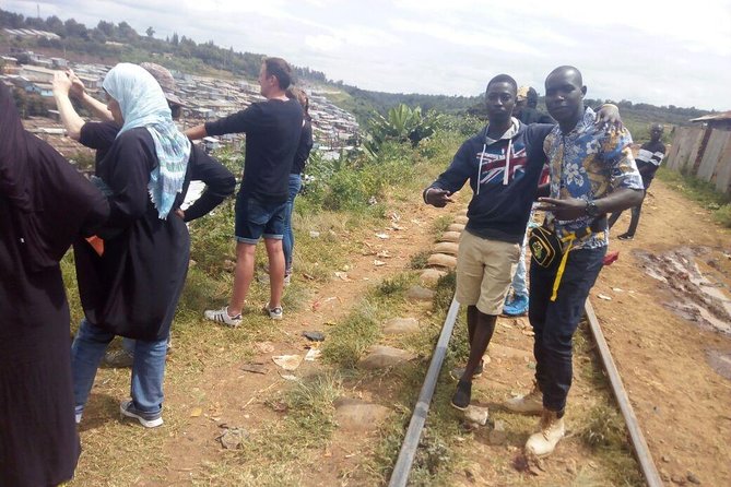 Full Day Kibera Slum Tour - A youth group completes the community picture