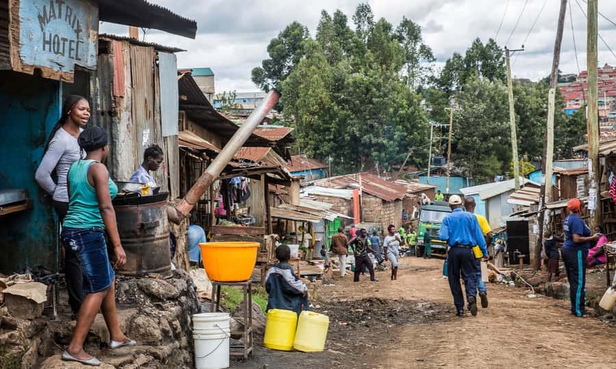 Half-Day Private Guided tour to Kibera Slum in Nairobi. - Walking through Kibera with a guide