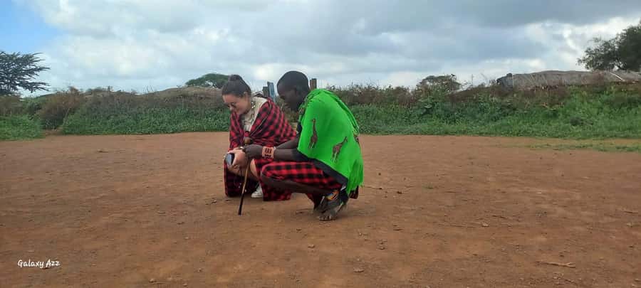 Maasai Cultural Village Tour: Traditions, Dance & Daily Life - Trying goat milking and preparing ugali