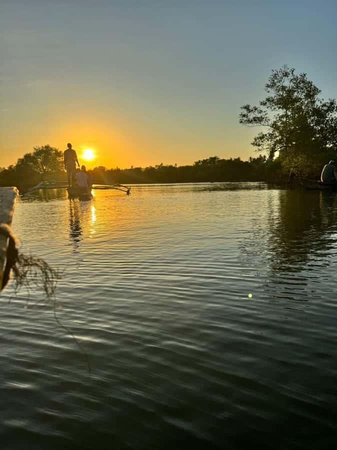 mangrove tour - Boarding a traditional canoe on the Kongo River