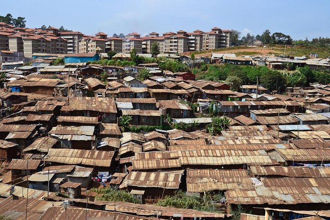 Nairobi Guided Tour to Kibera Slums - Nursery schools, water vendors, and shower shops